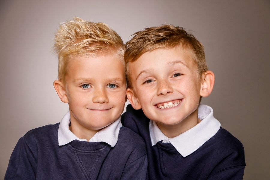 Two brothers smiling at the camera